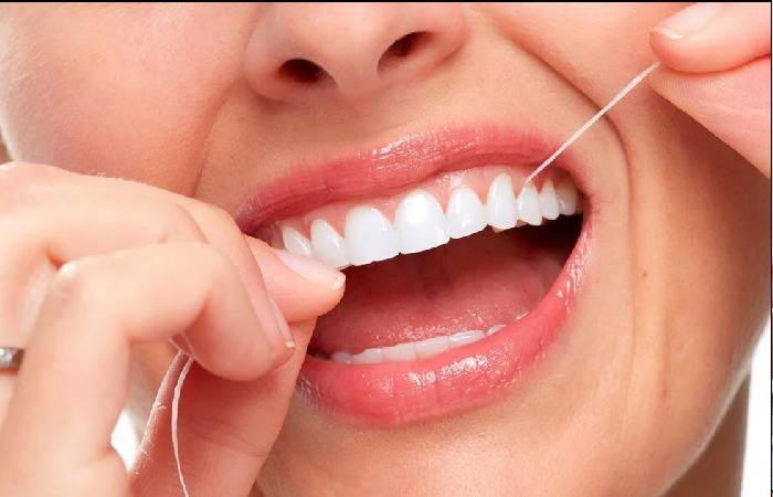 floss daily to remove hidden plaque